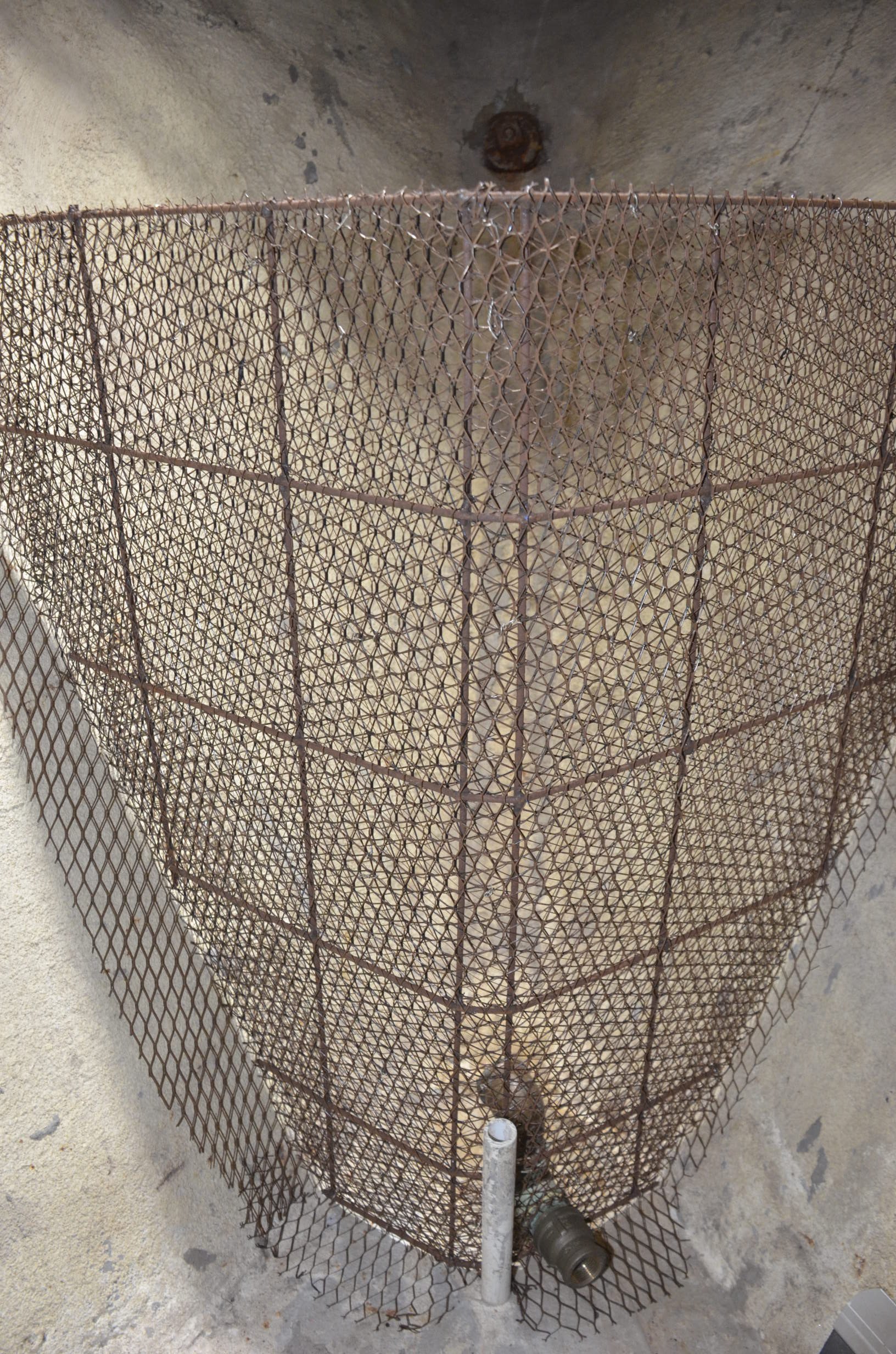 Closeup of entire armature including lathing cloth used to blend to walls and floor