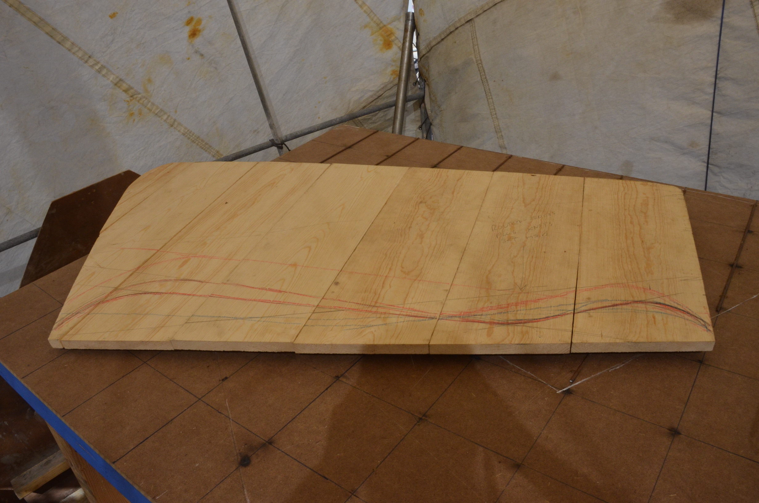 This is the process for making an armature.  The mold was removed from the support shown above.  The mold is then traced, and the armature is made on a plywood marked with a 6