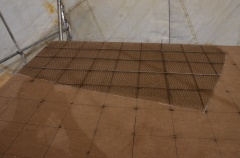 After the second layer is laid down, rebar is welded above the wire in the opposite direction