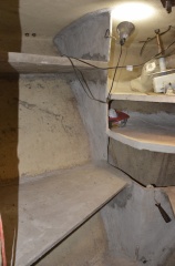 Closer view of the shelves and wall